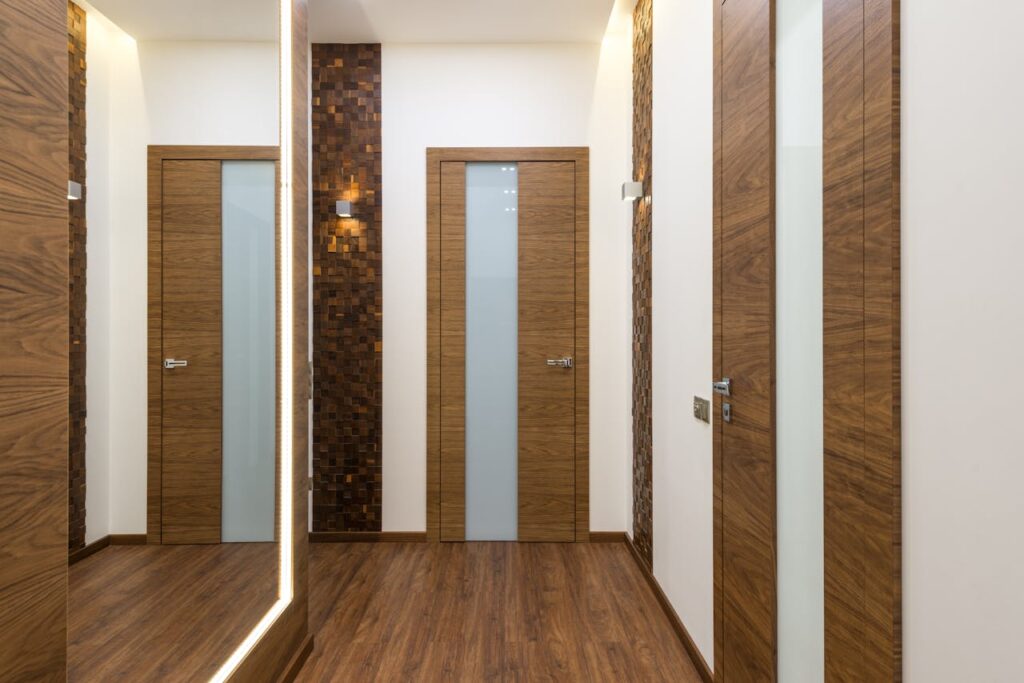 Stylish hallway featuring wooden doors and elegant design elements, perfect for modern interiors.